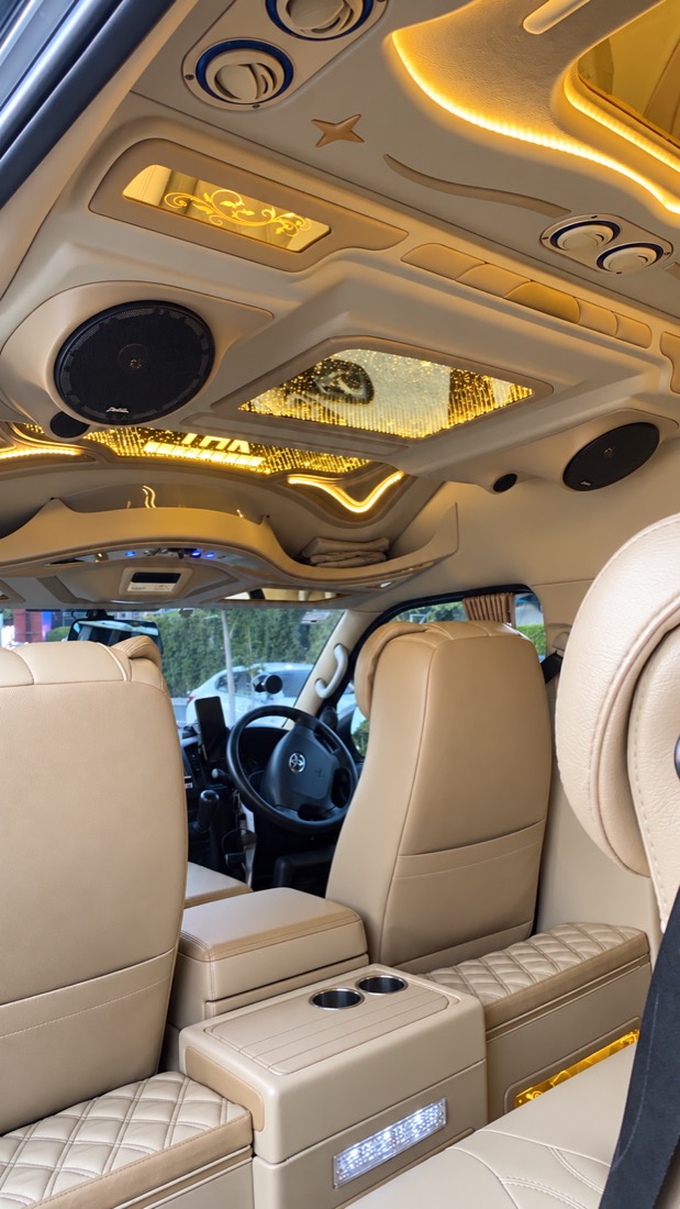 Inside Sonny's VIP van: beige leather seats, ambient lighting and a starlit ceiling