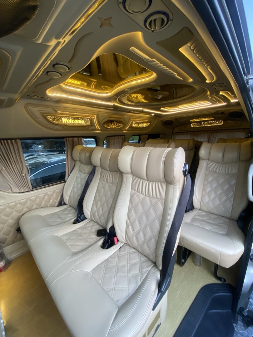 Plush diamond-stitched leather seats inside the VIP van
